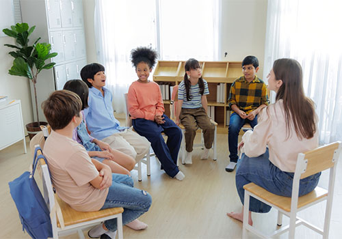 A speech pathologist working with a child at the UC Health Hub.