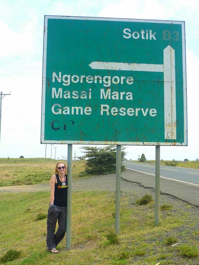 Claire Hindle next to sign