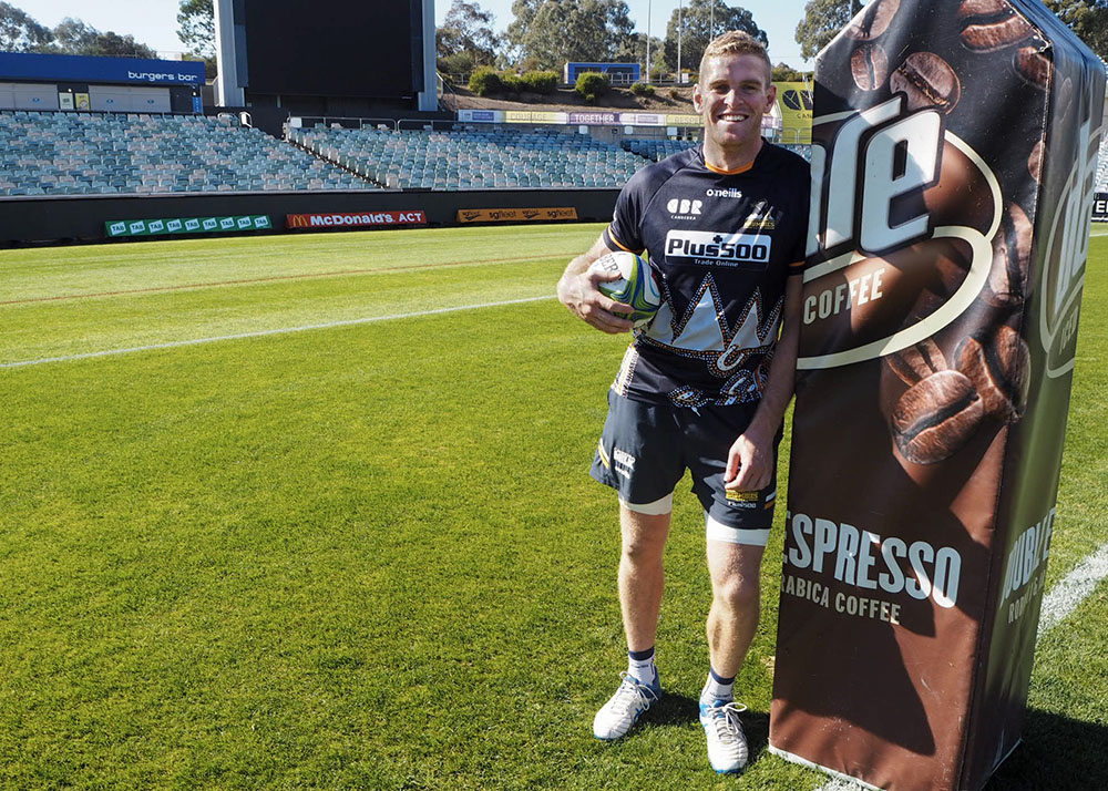 Tom Cusack on the field at GIO Stadium