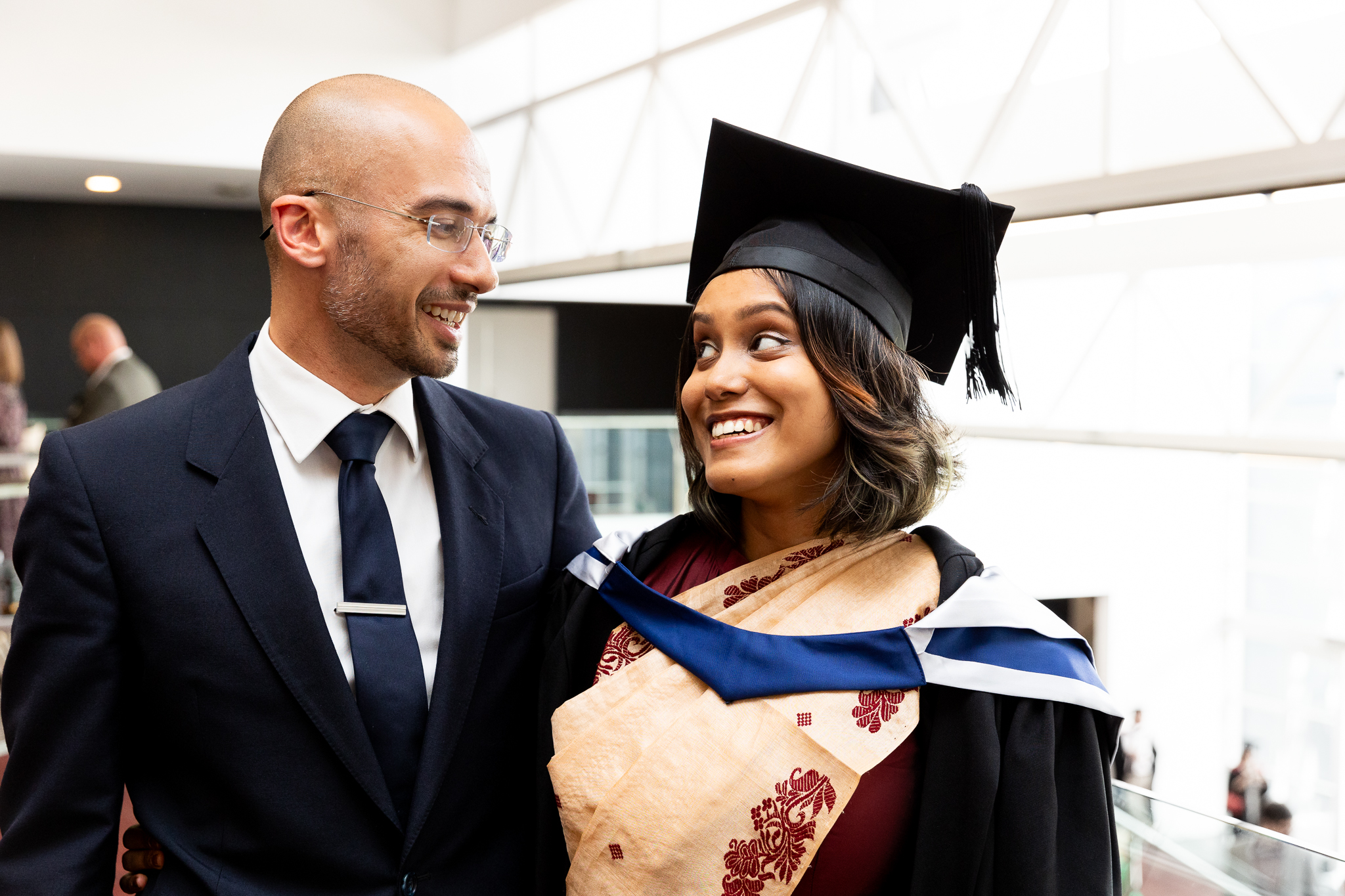 Man and woman look at one another and smile.